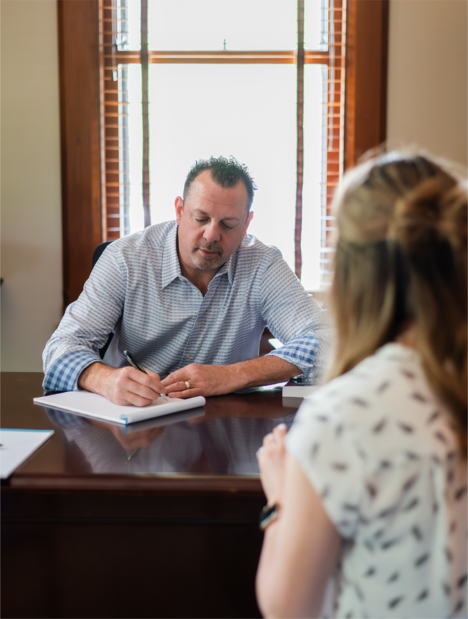Travis taking client notes